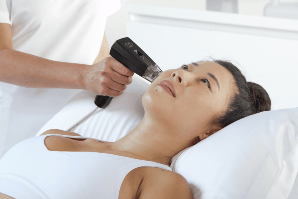 A medical professional using Morpheus8 technology at Revive Med Spa in Barrie, Ontario, for skin tightening and contouring on a patient's face and body. Morpheus8 combines microneedling with radiofrequency energy to stimulate collagen production, effectively treating wrinkles, sagging skin, and stubborn fat pockets for a more youthful and contoured appearance without the need for surgery.